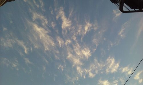 Low angle view of airplane flying in sky