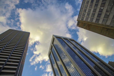 Low angle view of modern buildings against sky