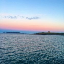 Scenic view of sea against clear sky during sunset