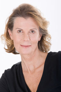 Portrait of a smiling young woman over white background