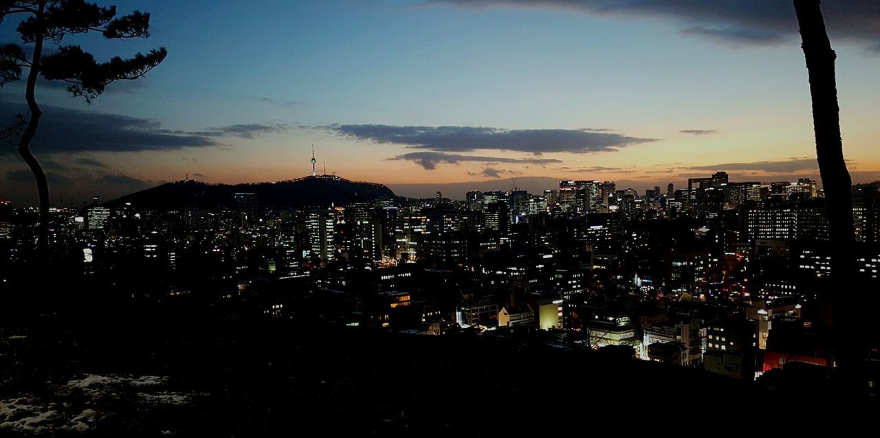 cityscape, city, building exterior, illuminated, architecture, built structure, crowded, sky, high angle view, sunset, residential district, residential building, night, residential structure, silhouette, dusk, city life, cloud - sky, skyscraper, community