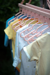 Close-up of clothes hanging on rack