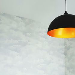 Close-up of hanging against sky