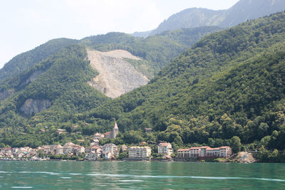 Scenic view of river with mountains in background