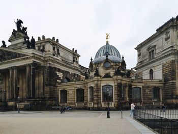 Facade of historic building against sky