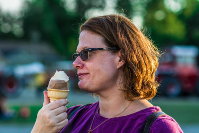 Close-up of woman holding ice cream cone