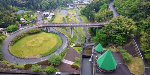 High angle view of street amidst trees in city