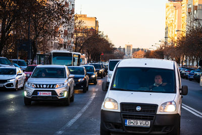 Traffic on city street at dusk