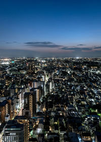 High angle view of city buildings at night