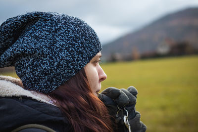 Portrait of young woman wearing hat