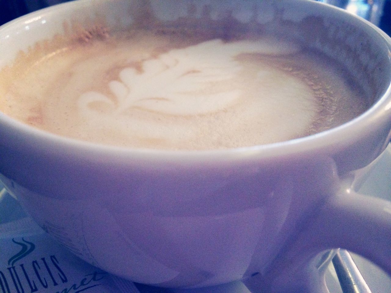 drink, food and drink, refreshment, indoors, coffee cup, close-up, frothy drink, coffee - drink, freshness, still life, table, coffee, cappuccino, saucer, froth art, high angle view, cup, spoon, beverage, no people