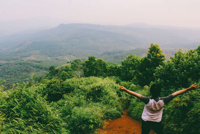 Rear view of woman looking at mountain