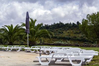 Sun loungers beside swimming pool