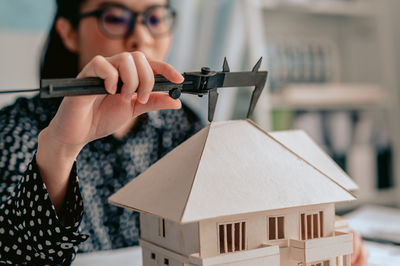 Architect making model house at home