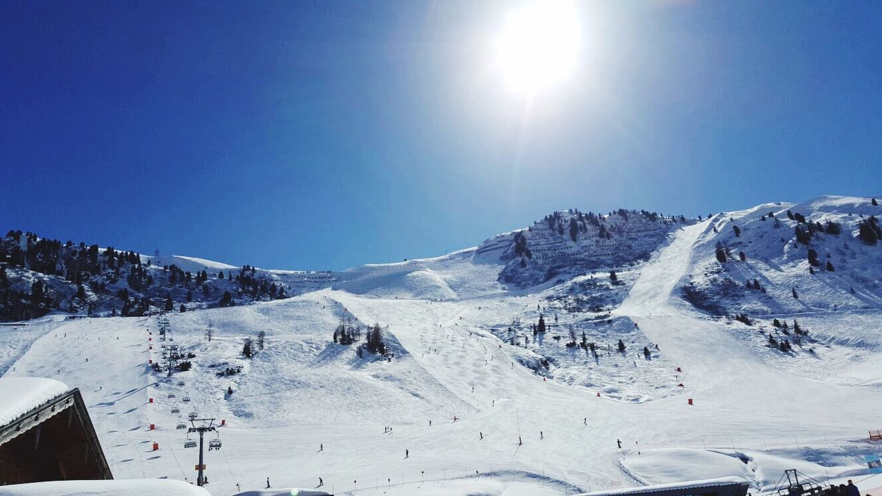 snow, cold temperature, winter, sunlight, beauty in nature, sky, nature, mountain, scenics, idyllic, tranquil scene, landscape, tranquility, day, ski track, outdoors, no people, ski holiday