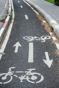 High angle view of arrow sign on road