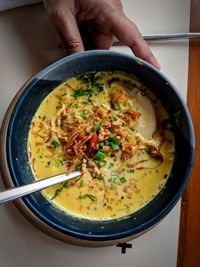 Directly above shot of soup in bowl on table