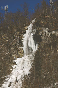 Stream flowing through rocks in forest