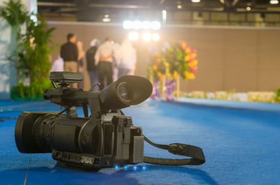 Close-up of home video camera on table at wedding