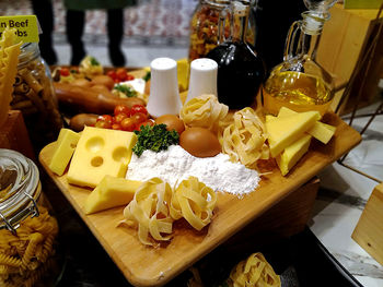 High angle shot of various ingredients for a pasta dish