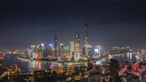 Illuminated buildings in city at night