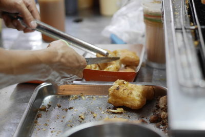 Close-up of person preparing food