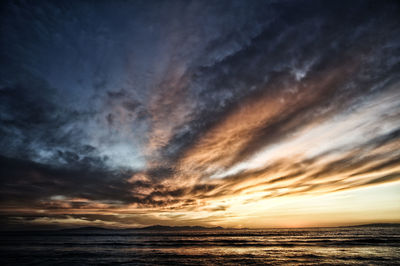 Scenic view of sea against dramatic sky