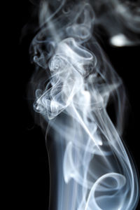 Close-up of smoke against black background