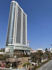 Modern buildings against clear blue sky