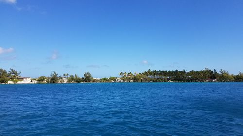 Scenic view of sea against clear blue sky