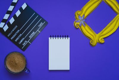 High angle view of coffee on table against blue background