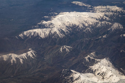 High angle view of snowcapped mountains during winter