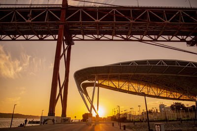 Low angle view of bridge against sky during sunset