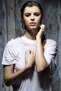 Portrait of sensuous woman taking shower