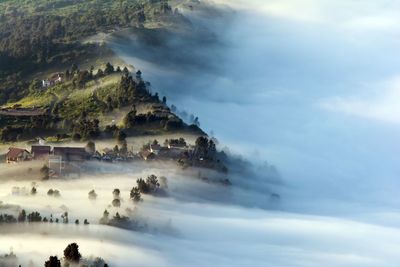 Aerial view of mountains during foggy weather