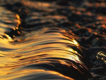 Full frame shot of water flowing at sunset