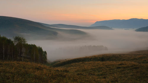 Scenic view of mountains against sky during sunset