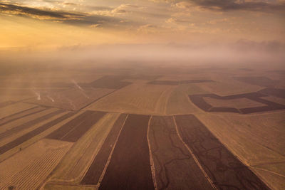 Aerial view of landscape during sunset