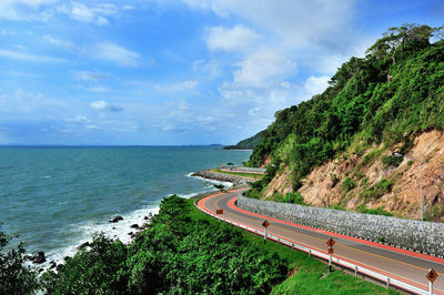 Road by sea against sky