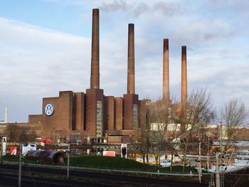 Factory against sky in city