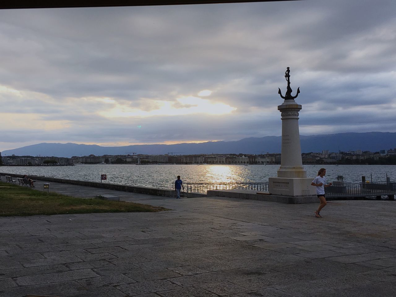 VIEW OF PEOPLE ON CALM LAKE