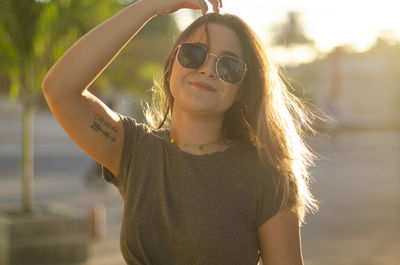 Portrait of young woman wearing sunglasses