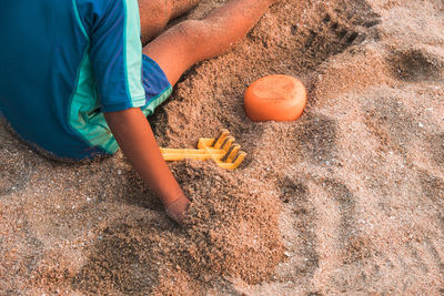 High angle view of man working on sand