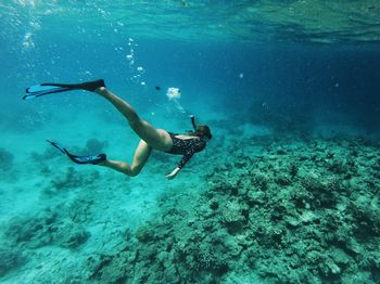 Full length of woman swimming in sea