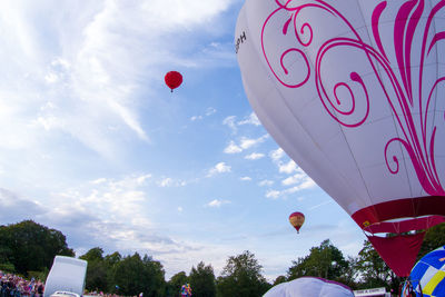 Low angle view of hot air balloons against sky