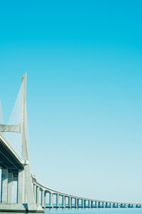 Low angle view of bridge against blue sky