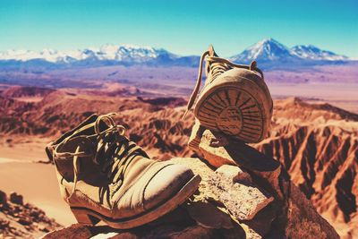 Close-up of boots on rock at atacama desert