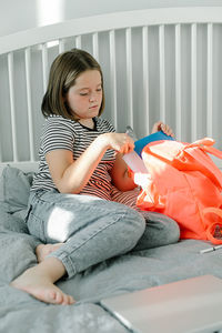 Young woman sleeping on bed at home