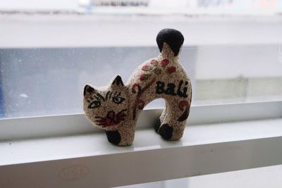Rear view of cat with toy