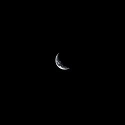 Low angle view of moon against sky at night